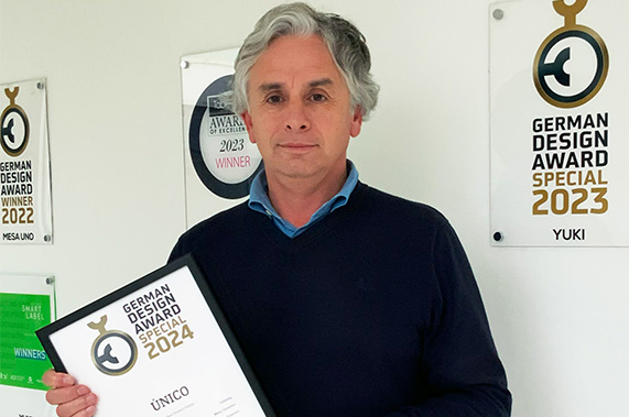 Company's CEO holding international awards.